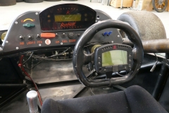 AIM-dash-on-removable-steering-wheel-and-Radical-dash-with-2-blue-fan-switches-center-of-steering-wheel14679