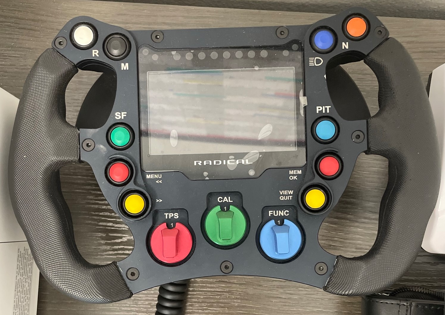 You are currently viewing Ask the Radical Factory Question #5 – Can the Radical version of the Aim SW4 steering wheel used on the SR10 be adapted for use on earlier SR3 and SR8 cars with the Life ECU?